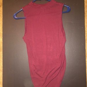 A burgundy body suit